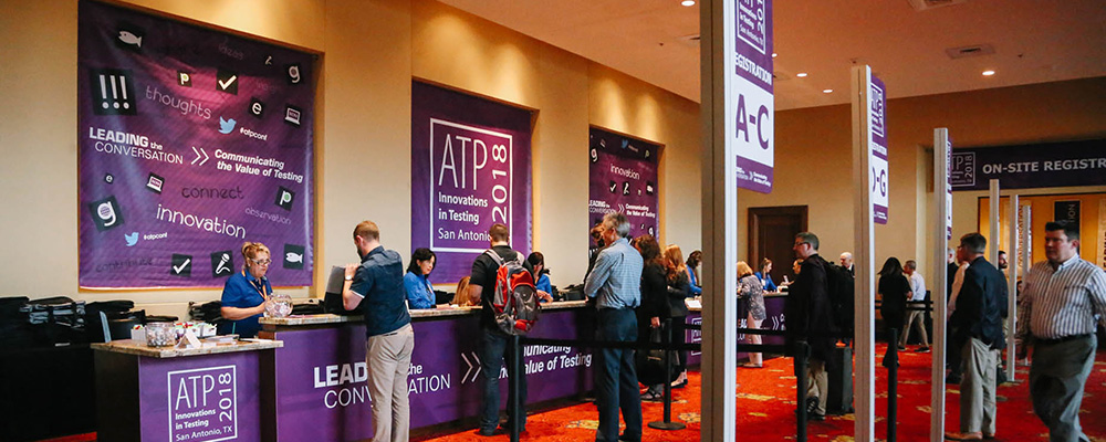 Attendees registering for the conference